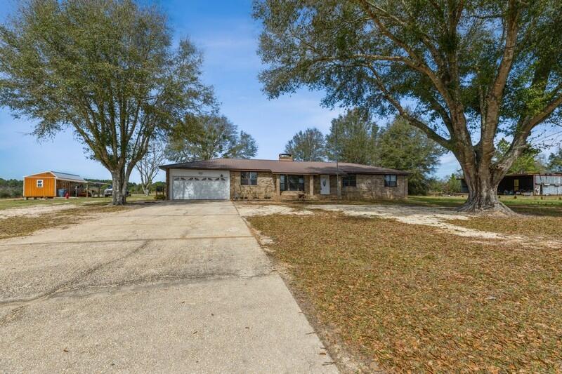6246 Holloway Road Baker, FL 32531 - Photo 7 of 52 a front view of house with yard
