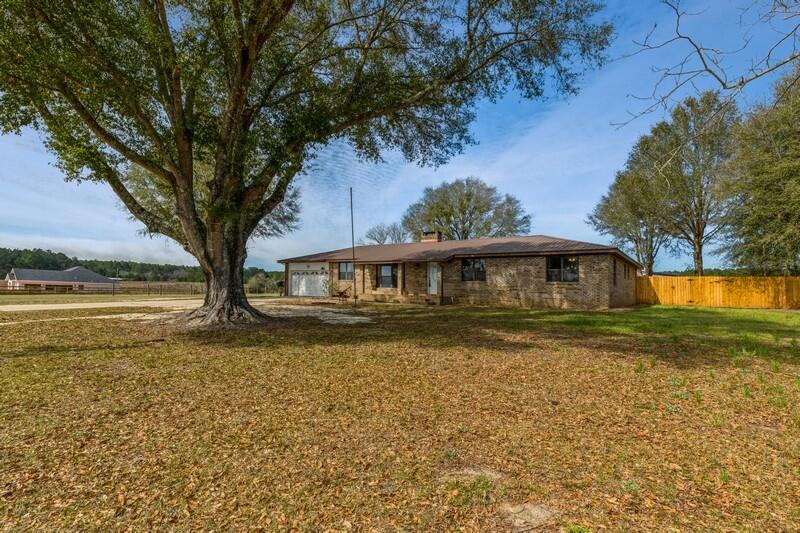 6246 Holloway Road Baker, FL 32531 - Photo 8 of 52 a front view of a house with a yard