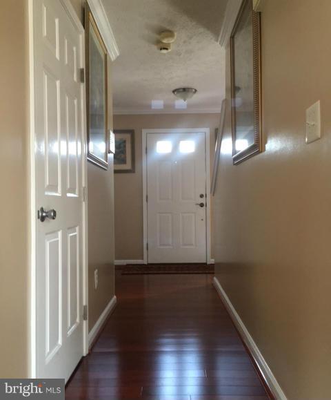 1403 Bretton View Road Annapolis, MD 21409 - Photo 2 of 30 a view of a hallway with wooden floor