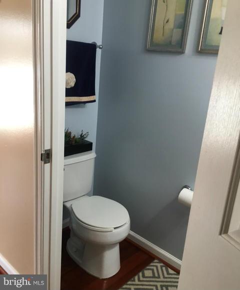 1403 Bretton View Road Annapolis, MD 21409 - Photo 11 of 30 a white toilet sitting next to a small sink