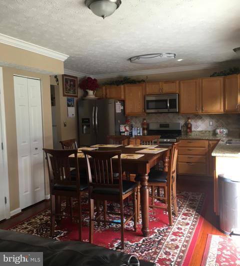 1403 Bretton View Road Annapolis, MD 21409 - Photo 13 of 30 a view of a dining room with furniture