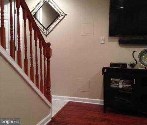 1403 Bretton View Road Annapolis, MD 21409 - Photo 17 of 30 a view of a hallway with wooden floor and staircase