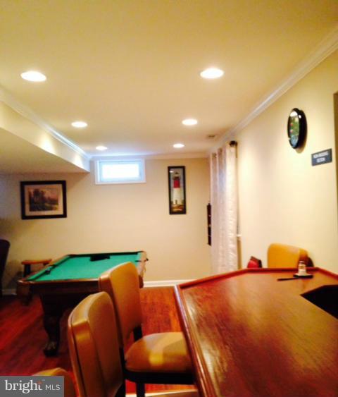 1403 Bretton View Road Annapolis, MD 21409 - Photo 21 of 30 a bedroom with a bed and a flat screen tv