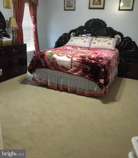 1403 Bretton View Road Annapolis, MD 21409 - Photo 6 of 30 a bedroom with a bed and cabinets