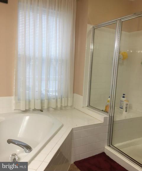 1403 Bretton View Road Annapolis, MD 21409 - Photo 7 of 30 a bathroom with a tub and a shower