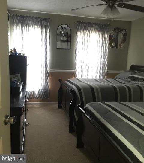 1403 Bretton View Road Annapolis, MD 21409 - Photo 9 of 30 a bedroom with a bed and a window