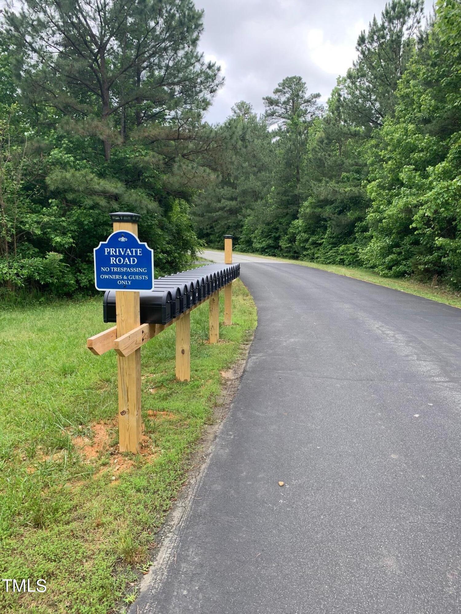 0 New Mayo Drive Roxboro, NC 27574 - Photo 5 of 9 a view of a lake with a park
