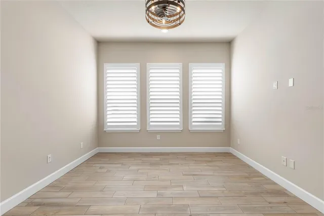 a kitchen with kitchen island a counter top space a sink stainless steel appliances and cabinets
