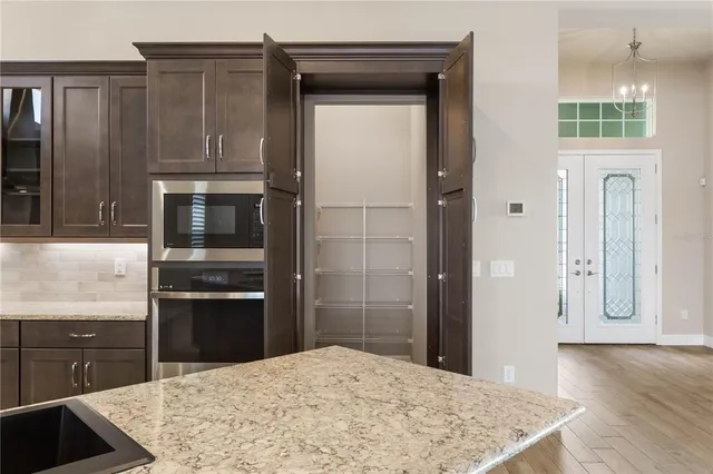 a kitchen with stainless steel appliances a sink and a stove