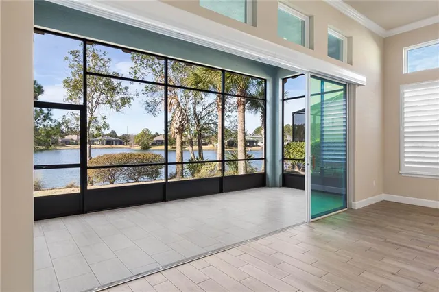 a view of an empty room with a large window