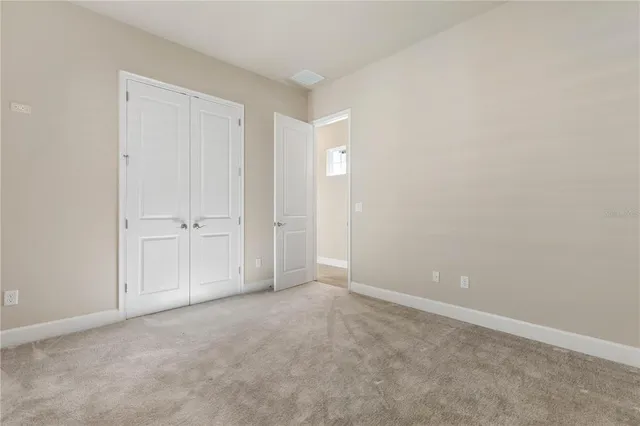 a view of an outdoor space with furniture and umbrella
