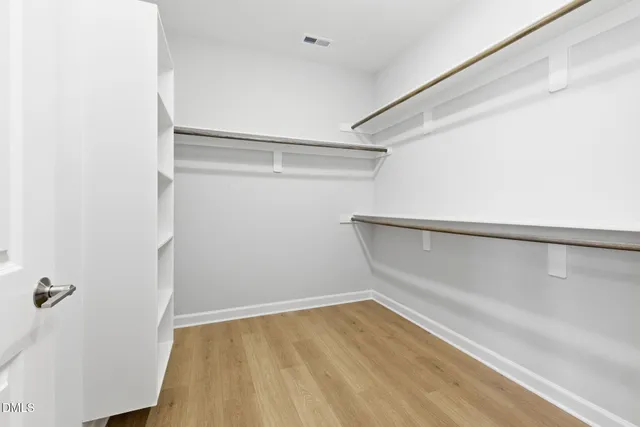 a view of an empty walk in closet