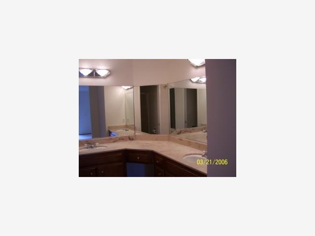 6118 Bollinger Road San Jose, CA 95129 - Photo 3 of 8 a bathroom with a sink and mirror