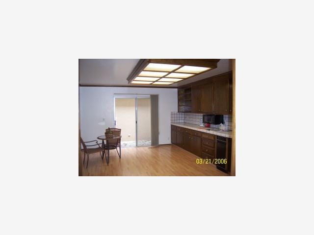 6118 Bollinger Road San Jose, CA 95129 - Photo 5 of 8 a kitchen with a sink cabinets and stainless steel appliances