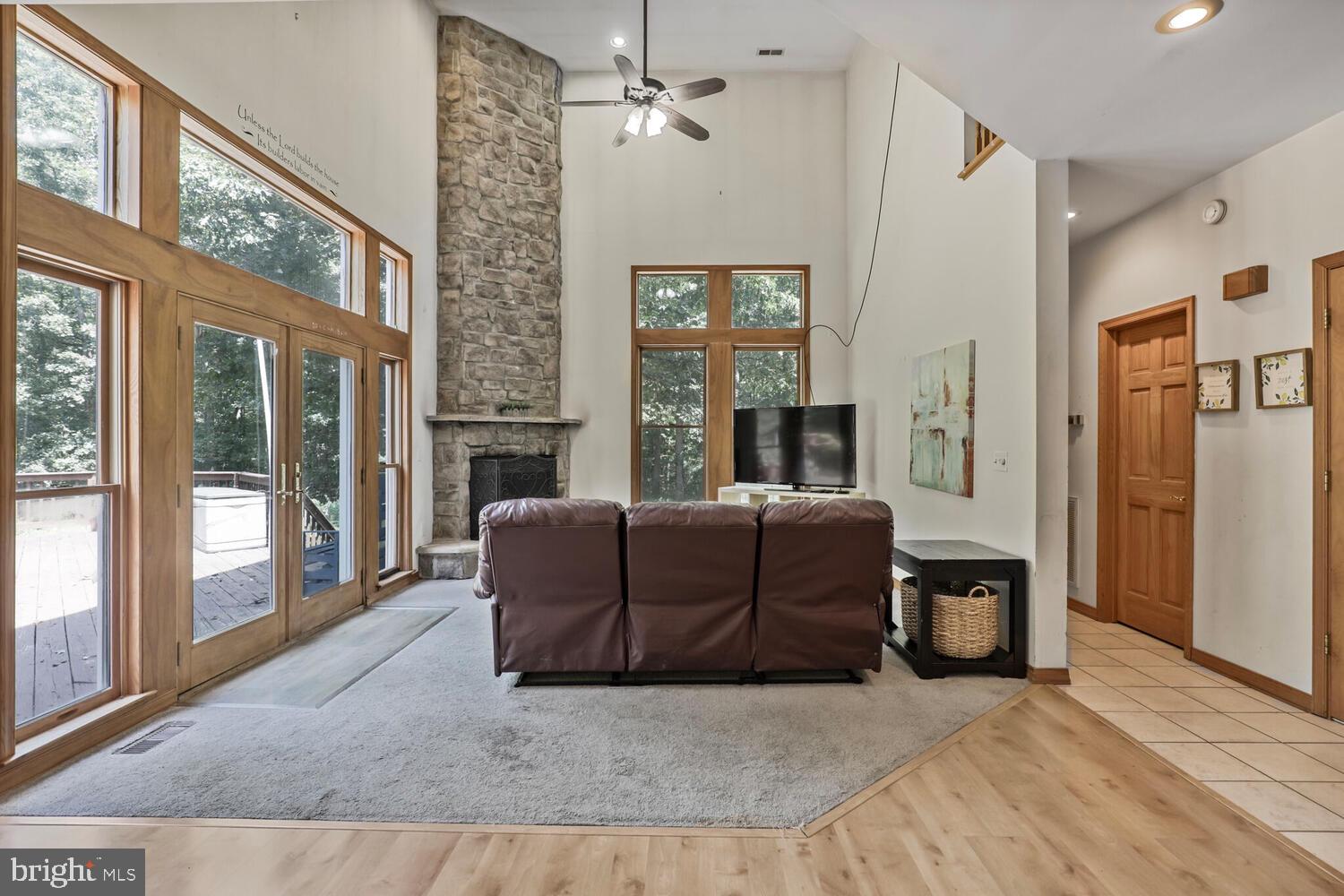 1761 Buckner Road Bumpass, VA 23024 - Photo 12 of 43 a living room with furniture and a fireplace
