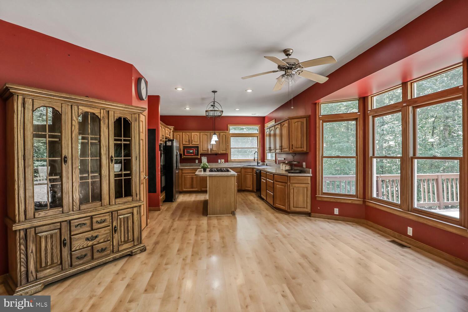 1761 Buckner Road Bumpass, VA 23024 - Photo 16 of 43 a living room with stainless steel appliances furniture and a large window