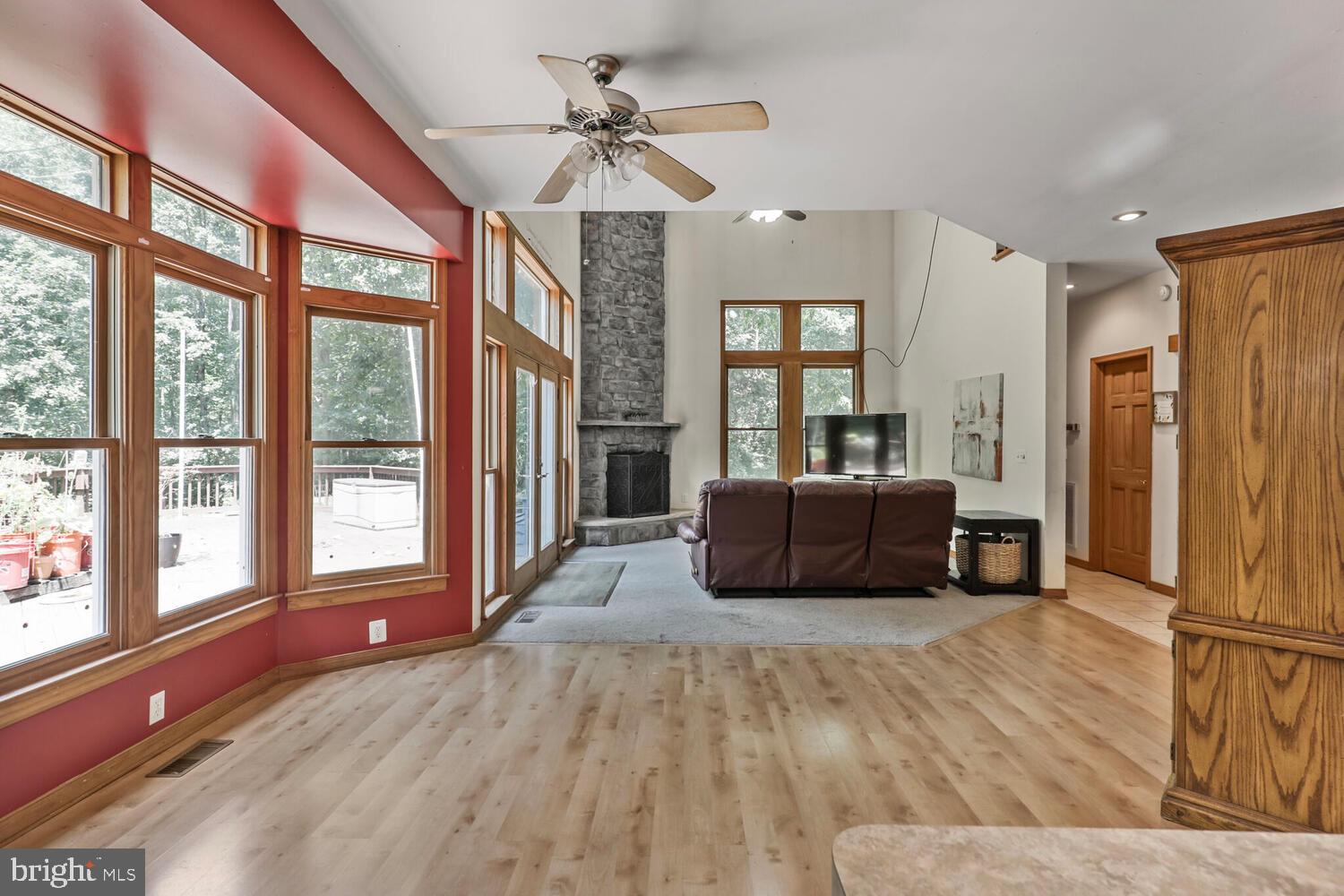 1761 Buckner Road Bumpass, VA 23024 - Photo 17 of 43 a living room with furniture and large windows