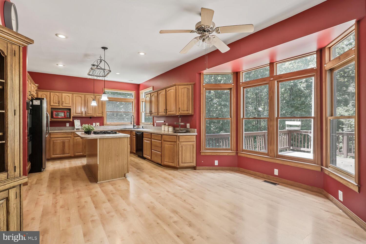 1761 Buckner Road Bumpass, VA 23024 - Photo 18 of 43 a large kitchen with cabinets and stainless steel appliances