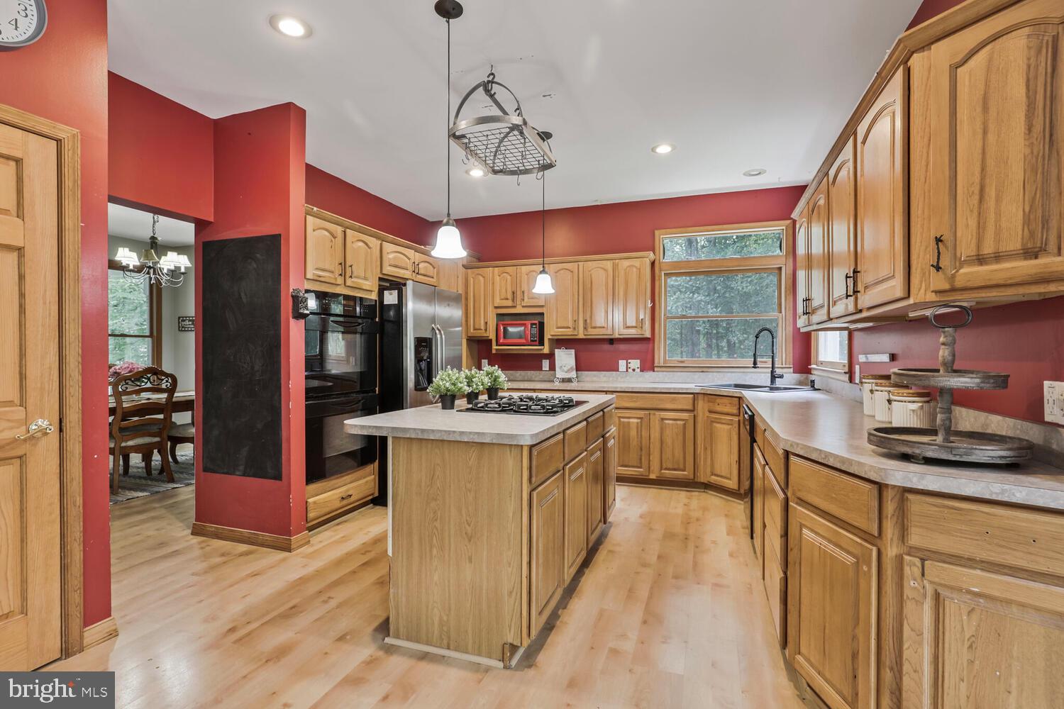 1761 Buckner Road Bumpass, VA 23024 - Photo 20 of 43 a kitchen with stainless steel appliances granite countertop a sink a stove and a refrigerator