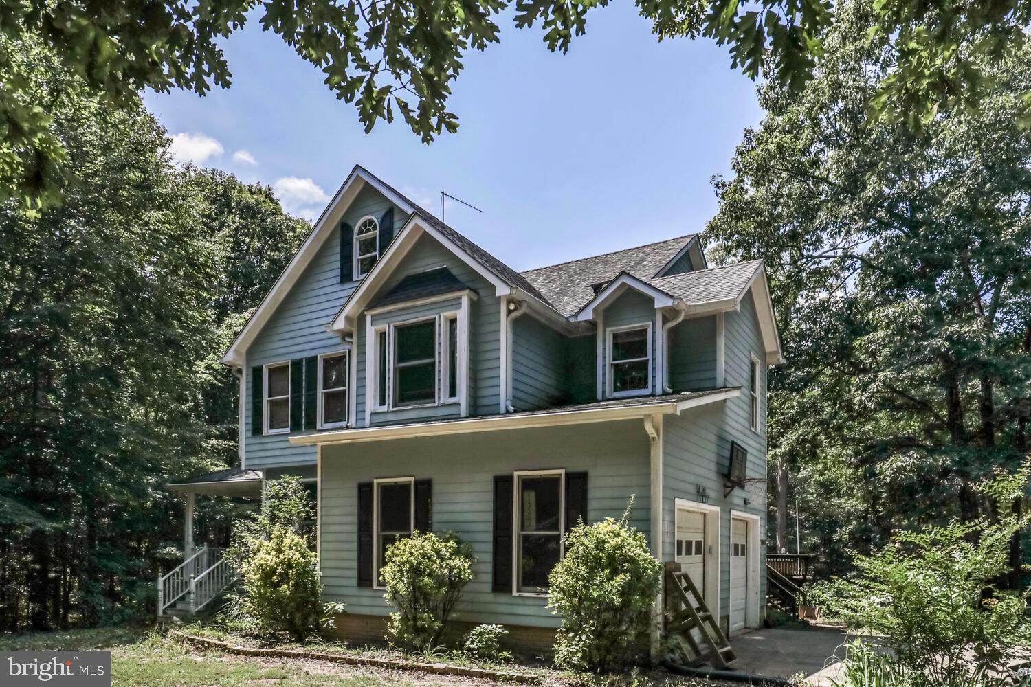 1761 Buckner Road Bumpass, VA 23024 - Photo 2 of 43 a front view of a house with garden