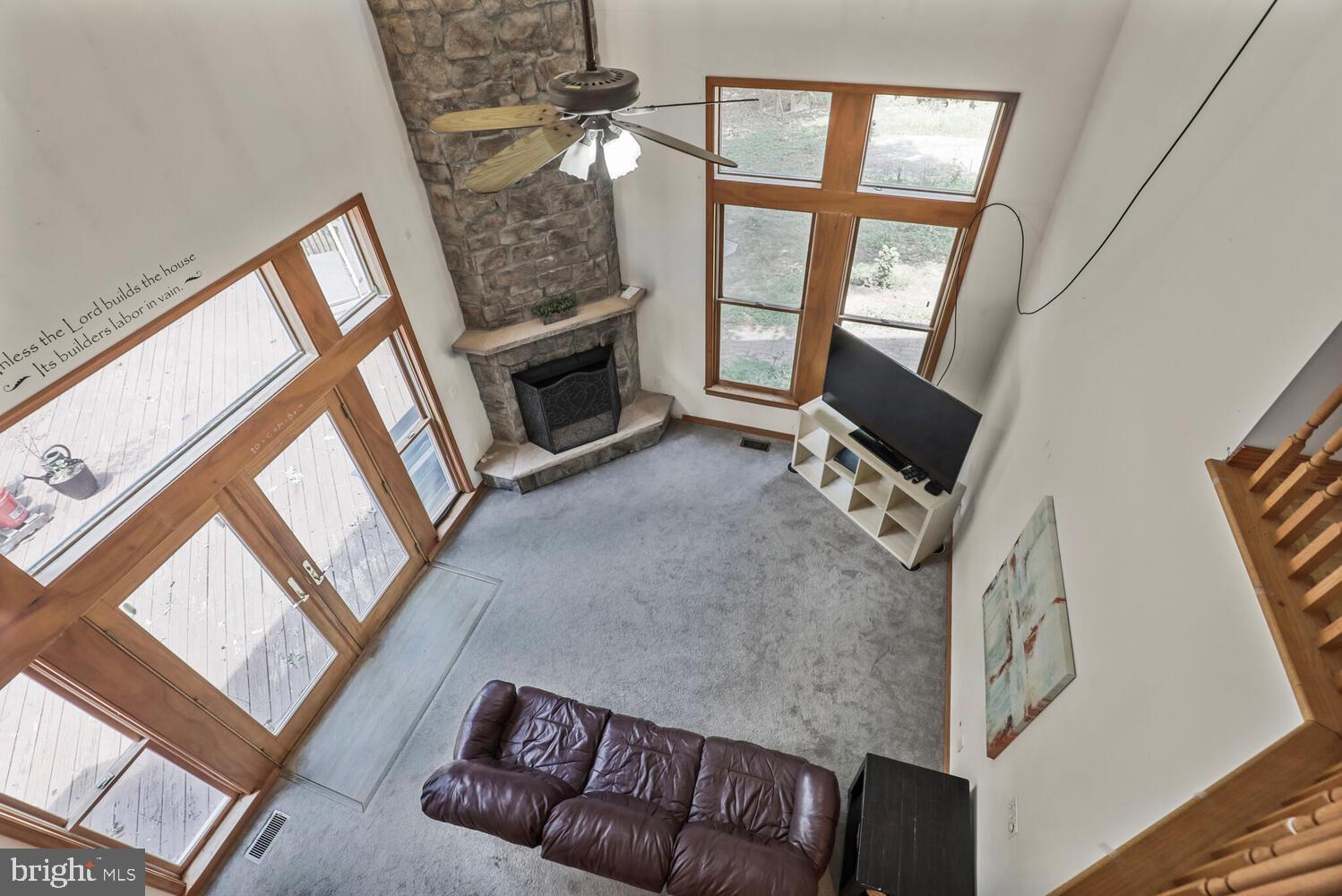 1761 Buckner Road Bumpass, VA 23024 - Photo 25 of 43 a living room with furniture and a flat screen tv