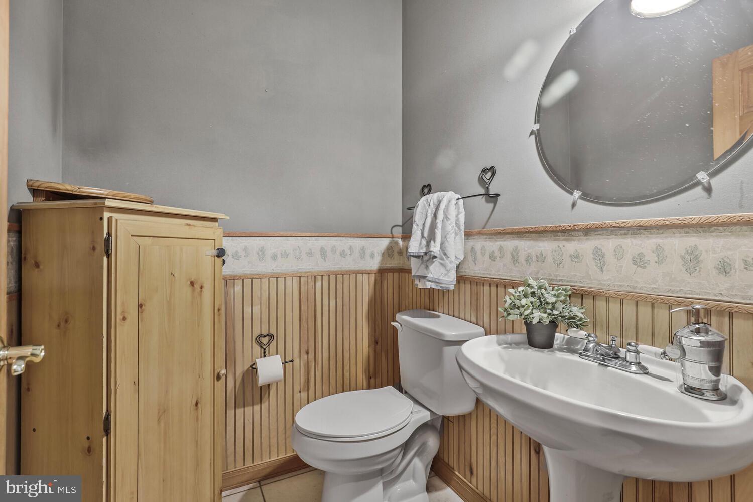 1761 Buckner Road Bumpass, VA 23024 - Photo 27 of 43 a bathroom with a sink toilet and a mirror