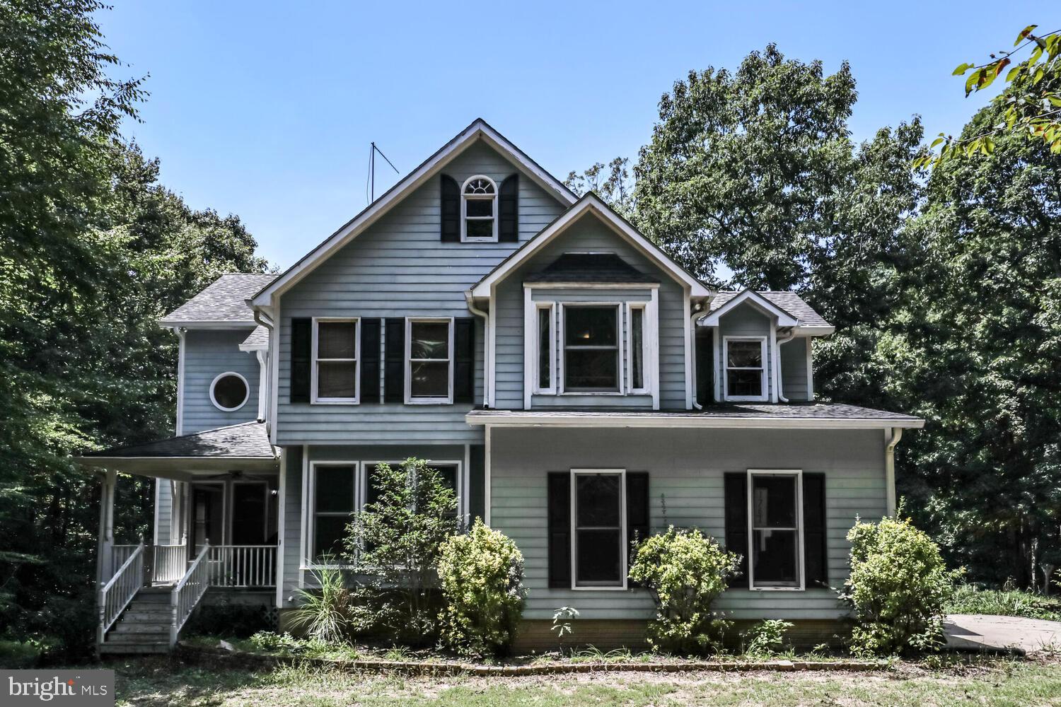 1761 Buckner Road Bumpass, VA 23024 - Photo 3 of 43 a front view of a house with garden