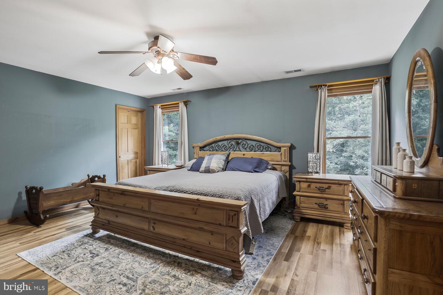 1761 Buckner Road Bumpass, VA 23024 - Photo 33 of 43 a bedroom with a bed and a chandelier