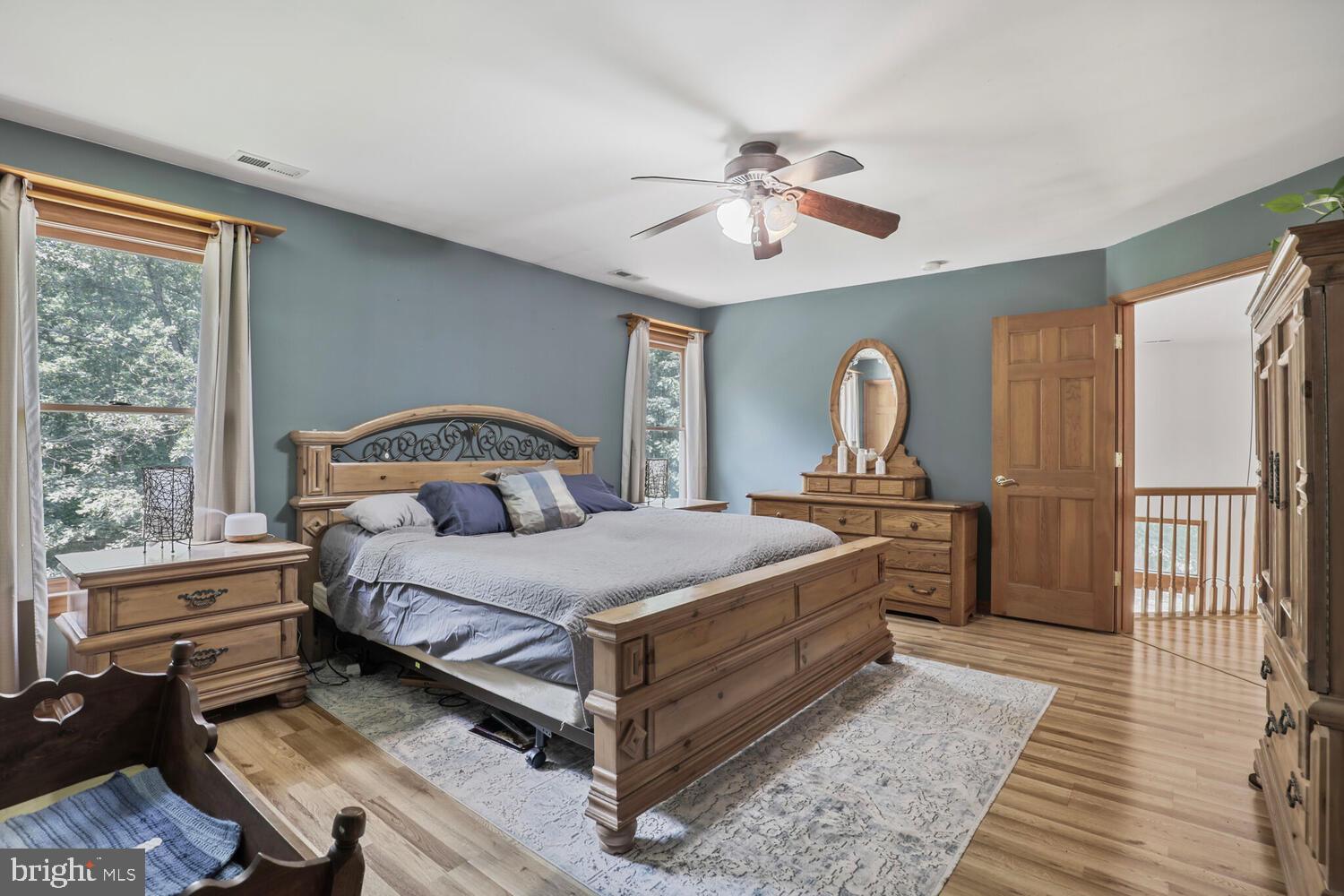 1761 Buckner Road Bumpass, VA 23024 - Photo 34 of 43 a bedroom with a bed and wooden floor