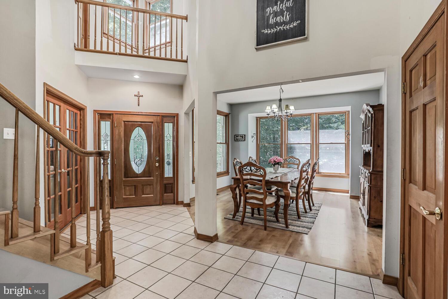 1761 Buckner Road Bumpass, VA 23024 - Photo 5 of 43 a dining room with furniture and a floor to ceiling window