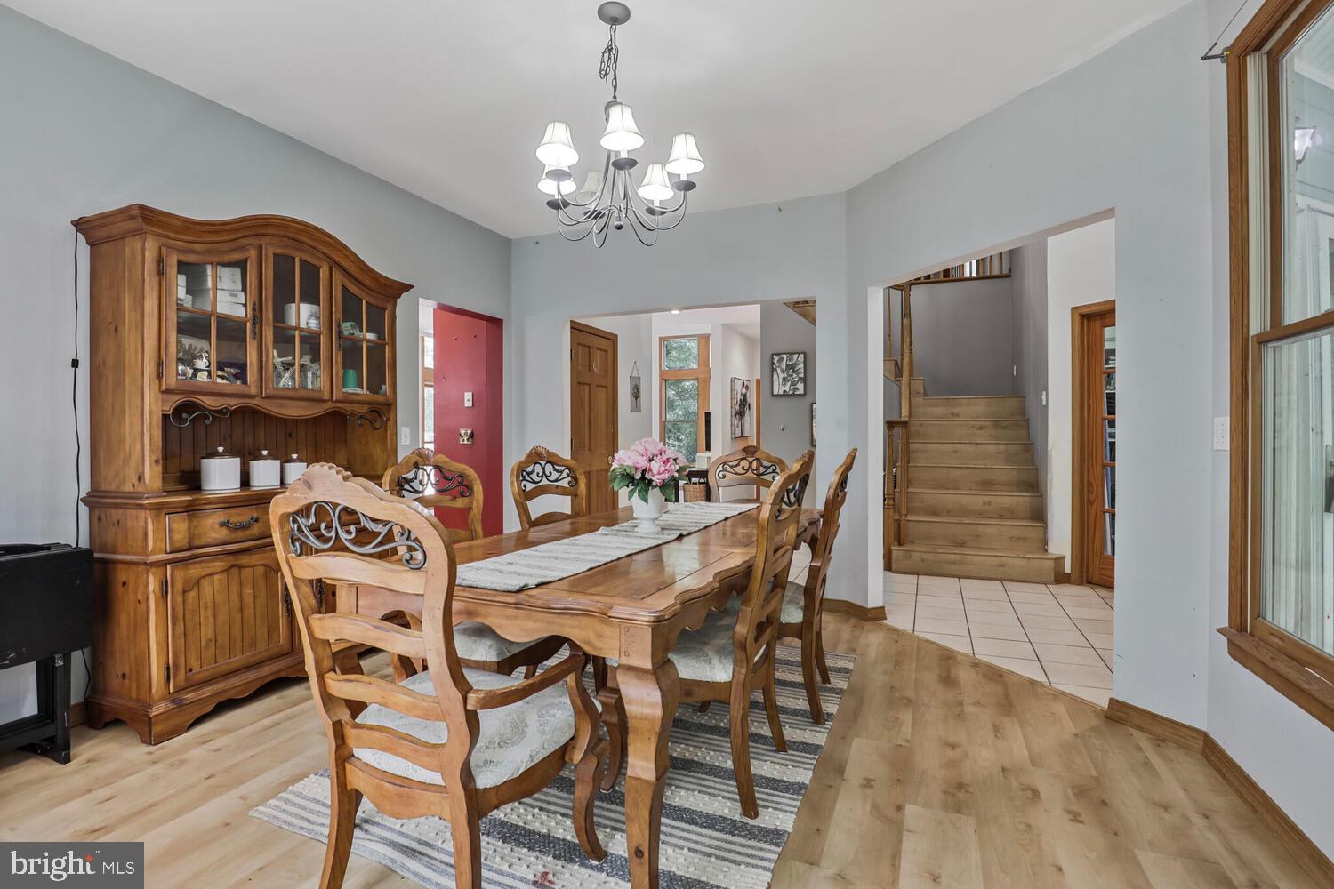 1761 Buckner Road Bumpass, VA 23024 - Photo 7 of 43 a view of a dining room with furniture and chandelier