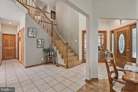 a view of an entryway with wooden floor