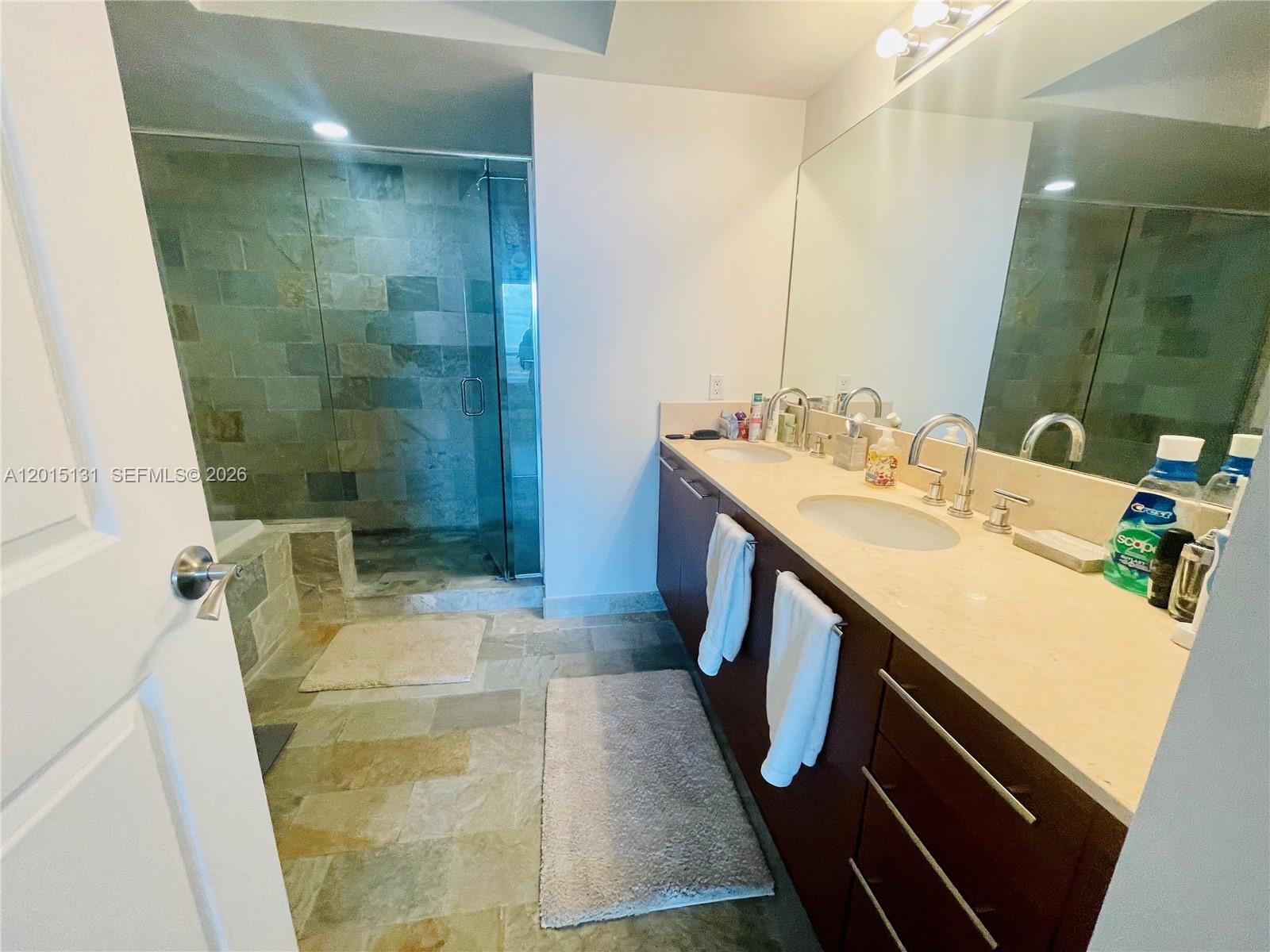 2681 North Flamingo Road, Unit 2004S Sunrise, FL 33323 - Photo 11 of 26 a bathroom with a sink and mirror