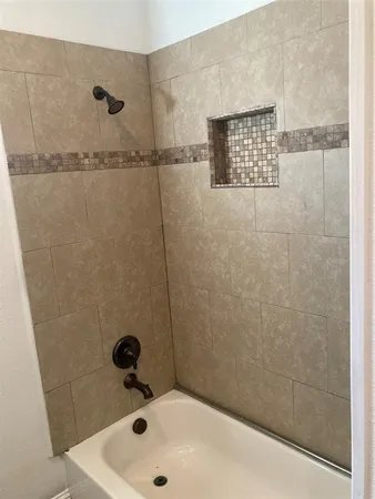 a bathroom with a granite countertop sink a toilet and mirror
