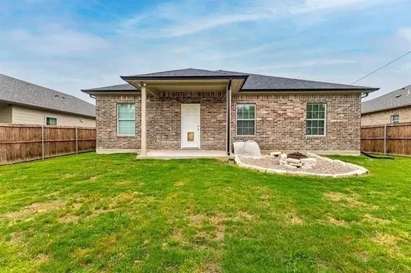 a view of a room with rack on the wall and a window