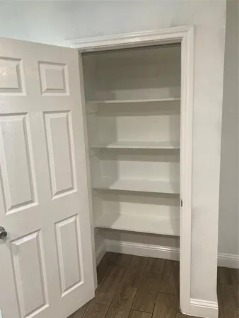 a large bathroom with a sink a mirror and a bathtub