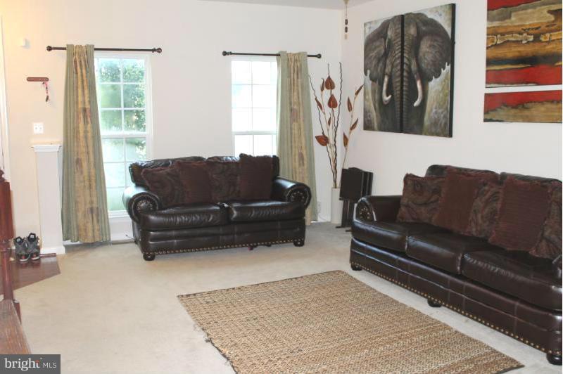 2630 St Marys View Road Accokeek, MD 20607 - Photo 2 of 25 a living room with furniture and a window