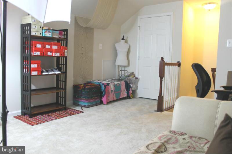 2630 St Marys View Road Accokeek, MD 20607 - Photo 11 of 25 a bed room with a bed and a mirror