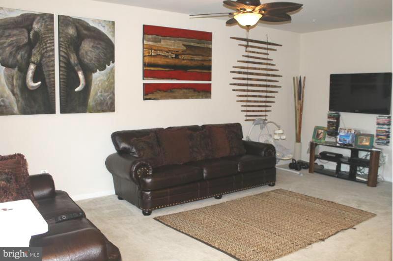 2630 St Marys View Road Accokeek, MD 20607 - Photo 3 of 25 a living room with furniture and a flat screen tv