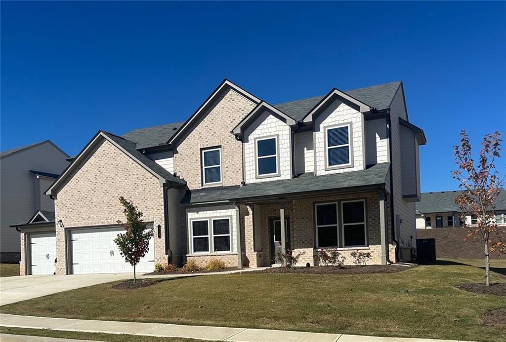 385 Rodeo Drive Auburn, GA 30011 - Photo 2 of 18 a front view of a house with a yard
