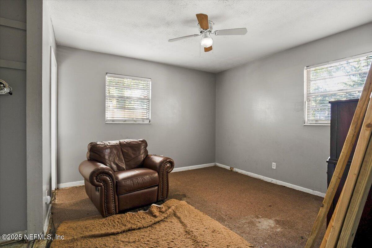 8514 Oak Leaf Road Jacksonville, FL 32208 - Photo 14 of 23 a living room with furniture and a window
