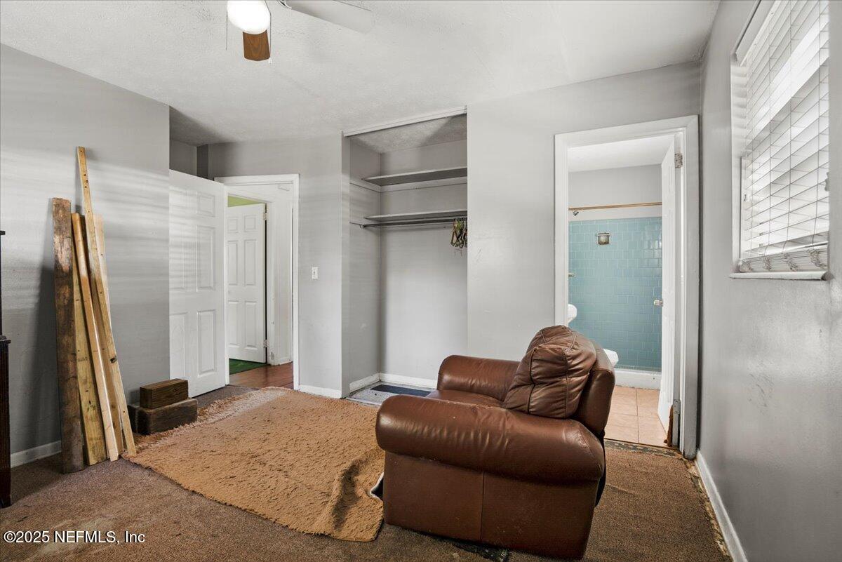 8514 Oak Leaf Road Jacksonville, FL 32208 - Photo 16 of 23 a living room with furniture and a window
