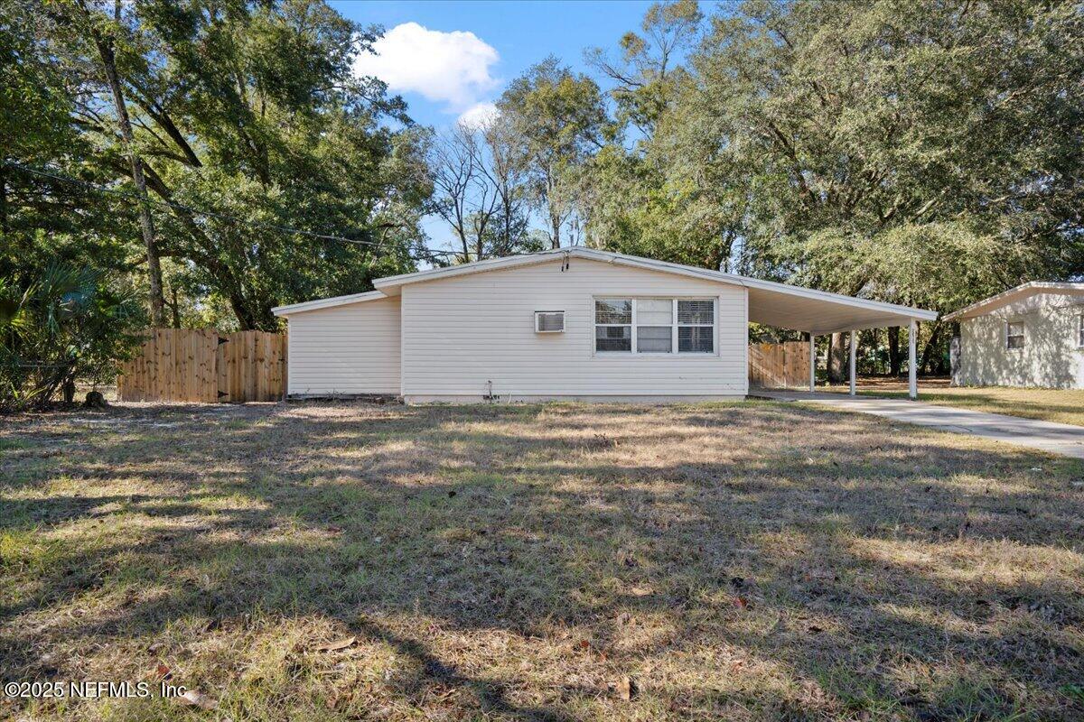 8514 Oak Leaf Road Jacksonville, FL 32208 - Photo 3 of 23 a house view with a backyard space