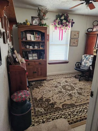 a living room with hard wood flooring and a couch