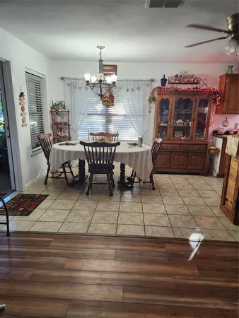a living room with lots of furniture and a wooden floor