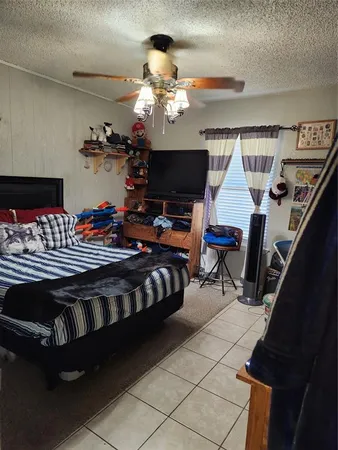 a bedroom with furniture and a chandelier