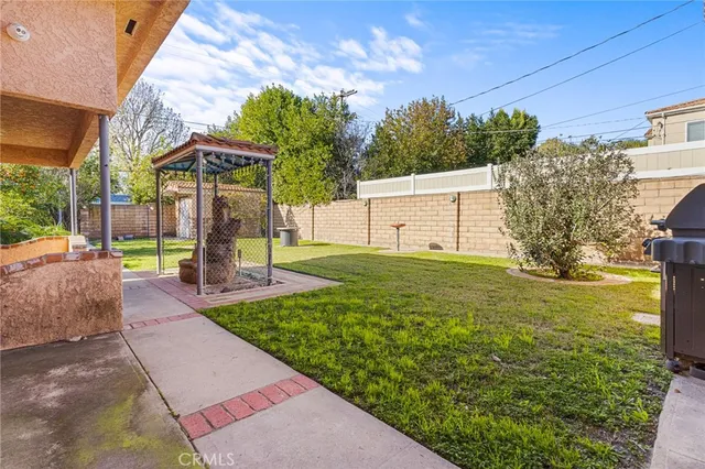 a view of a backyard with tree s
