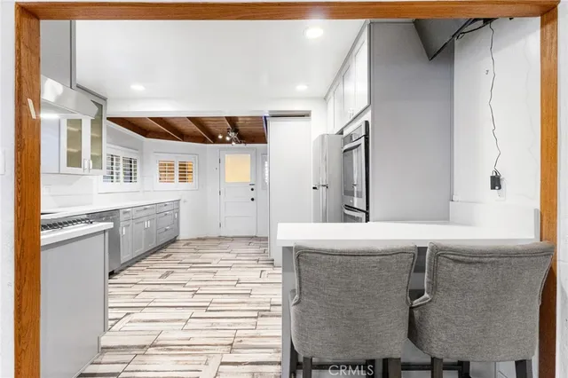 a bathroom with a granite countertop sink a toilet and shower