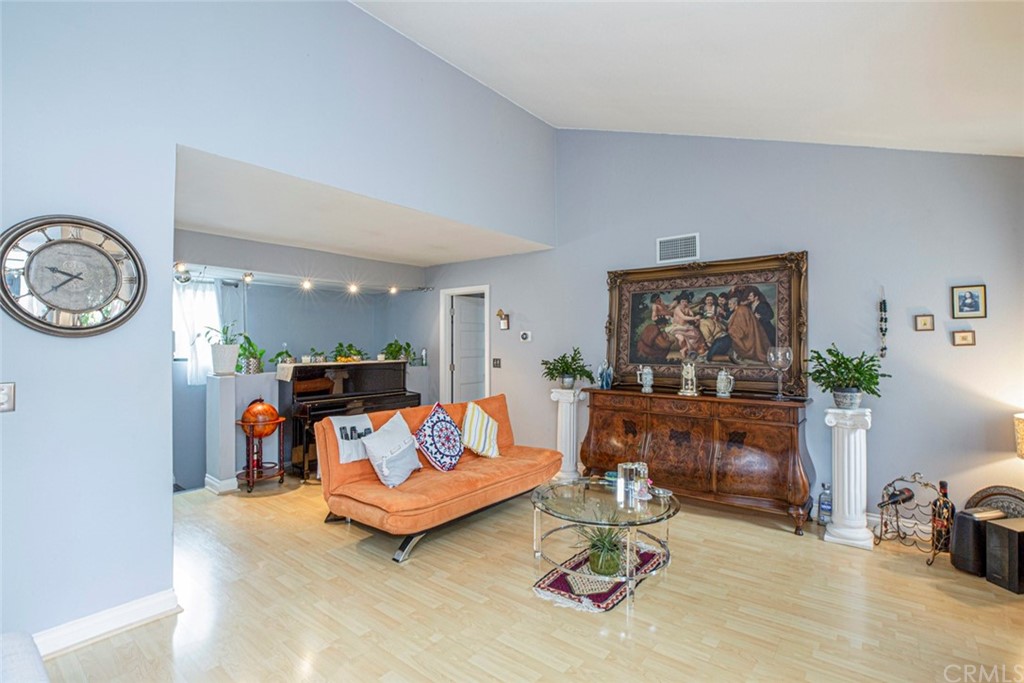 10504 Sunland Boulevard, Unit 5 Sunland, CA 91040 - Photo 12 of 66 a living room with furniture and a fireplace