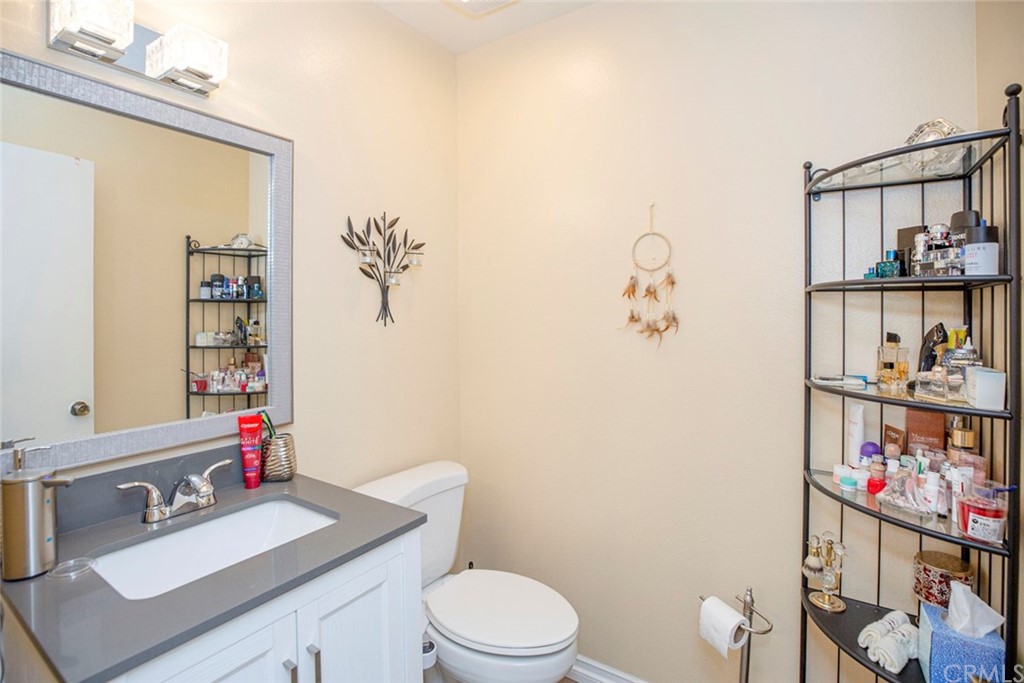 10504 Sunland Boulevard, Unit 5 Sunland, CA 91040 - Photo 22 of 66 a bathroom with a sink vanity mirror and toilet